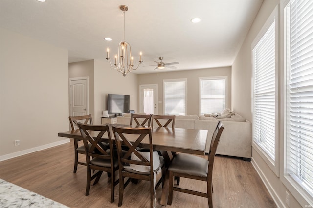 4755 Eastwick Dr, Newburgh, IN 47630 - dining space with baseboards, light wood finished floors, a chandelier, and recessed lighting