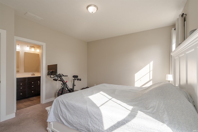 4755 Eastwick Dr, Newburgh, IN 47630 - bedroom with carpet, a sink, connected bathroom, and baseboards