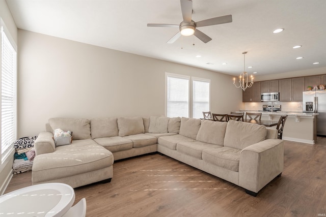 4755 Eastwick Dr, Newburgh, IN 47630 - living area featuring a chandelier, wood finished floors, plenty of natural light, recessed lighting, and a ceiling fan