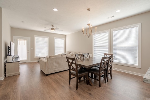 4755 Eastwick Dr, Newburgh, IN 47630 - dining room with baseboards, wood finished floors, a ceiling fan, a chandelier, and recessed lighting