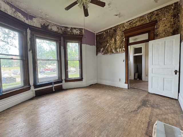 806 E Market St, Logansport, IN 46947 - empty room with a ceiling fan, crown molding, hardwood / wood-style floors, and baseboards