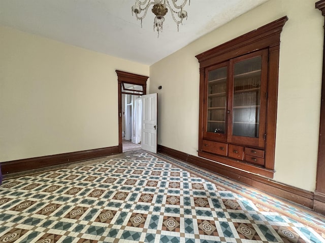 806 E Market St, Logansport, IN 46947 - empty room with baseboards and a chandelier