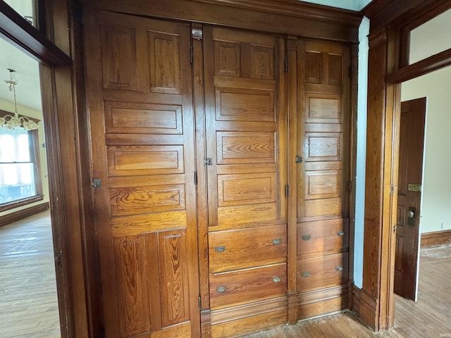 806 E Market St, Logansport, IN 46947 - detailed view of wood finished floors, a chandelier, and baseboards