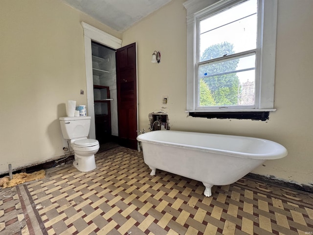 806 E Market St, Logansport, IN 46947 - bathroom with a freestanding bath and toilet