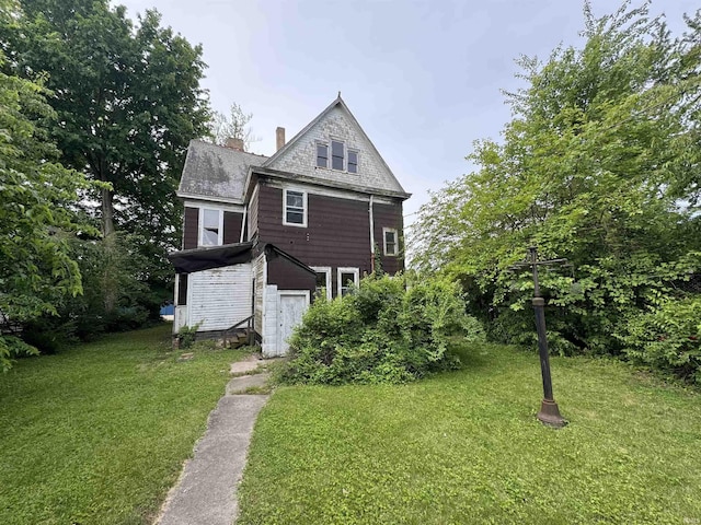 806 E Market St, Logansport, IN 46947 - view of front of property with a front lawn and a chimney