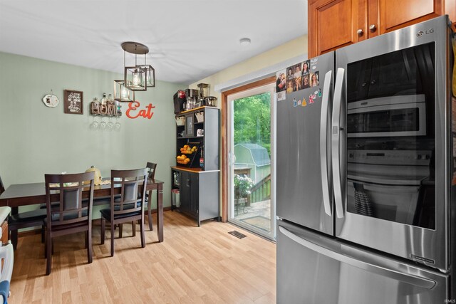 1804 Saint Charles Ct, Kokomo, IN 46902 - dining area with light wood finished floors and a chandelier