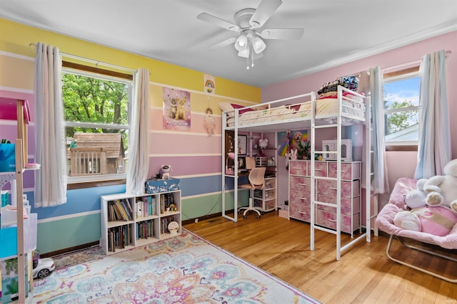 1804 Saint Charles Ct, Kokomo, IN 46902 - bedroom featuring wood finished floors, multiple windows, and a ceiling fan