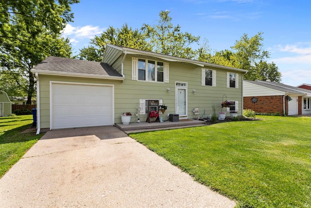 1804 Saint Charles Ct, Kokomo, IN 46902 - raised ranch with concrete driveway, a front yard, an attached garage, and roof with shingles