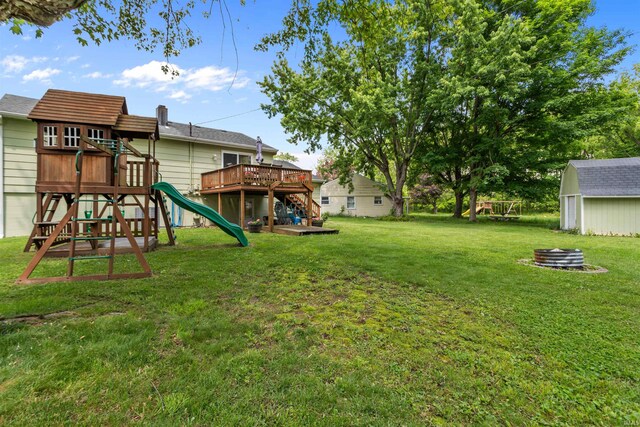 1804 Saint Charles Ct, Kokomo, IN 46902 - view of green lawn featuring a playground, a deck, and stairway