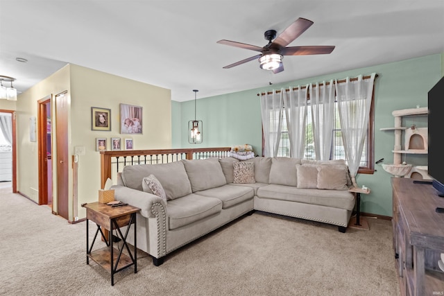 1804 Saint Charles Ct, Kokomo, IN 46902 - living room featuring carpet floors, a ceiling fan, a chandelier, and baseboards