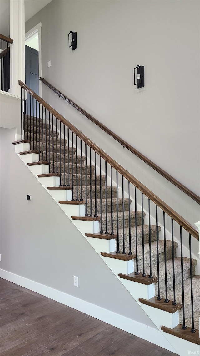 2022 W Blackberry Trl, Warsaw, IN 46582 - stairway featuring baseboards and wood finished floors