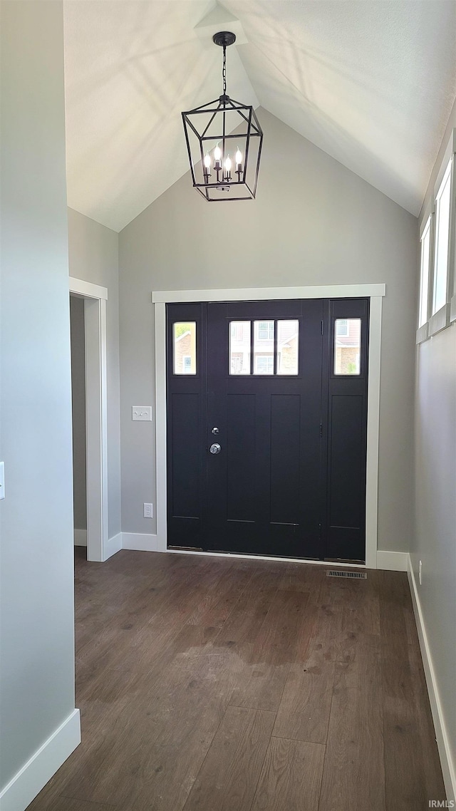 2022 W Blackberry Trl, Warsaw, IN 46582 - foyer entrance featuring a chandelier, dark wood finished floors, lofted ceiling, and baseboards