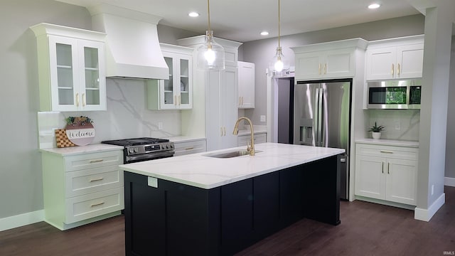 2022 W Blackberry Trl, Warsaw, IN 46582 - kitchen featuring a sink, appliances with stainless steel finishes, premium range hood, dark wood finished floors, and tasteful backsplash
