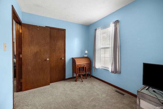 3739 S Westmont Ave, Bloomington, IN 47403 - carpeted bedroom featuring baseboards and a closet