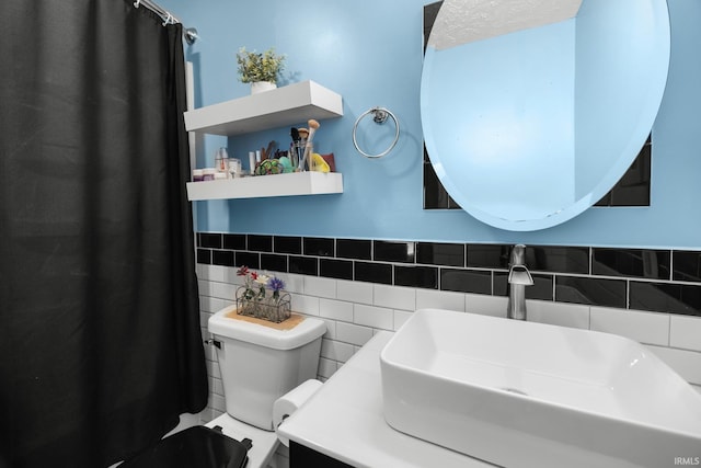 3739 S Westmont Ave, Bloomington, IN 47403 - bathroom featuring toilet, tile walls, vanity, and a shower with curtain