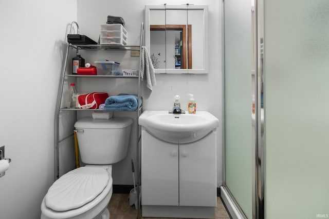3739 S Westmont Ave, Bloomington, IN 47403 - bathroom featuring toilet, vanity, and a shower stall