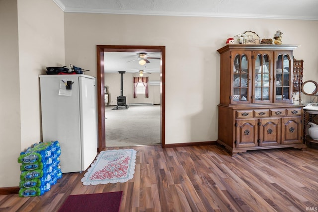 3739 S Westmont Ave, Bloomington, IN 47403 - hall featuring wood finished floors, baseboards, ornamental molding, and a baseboard heating unit