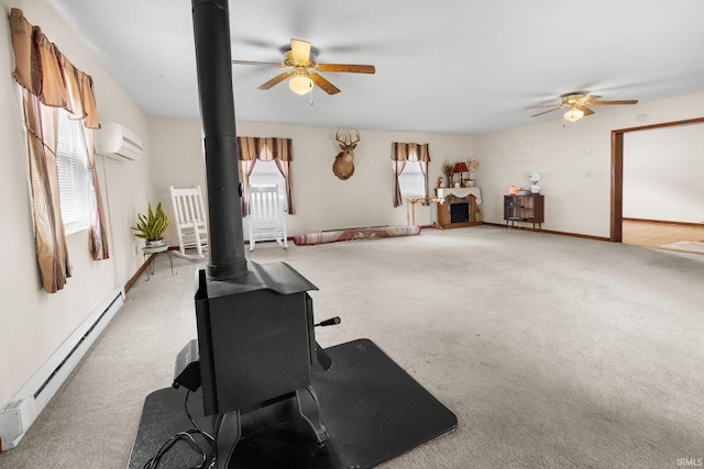 3739 S Westmont Ave, Bloomington, IN 47403 - workout area featuring a wood stove, a ceiling fan, a baseboard radiator, and a wall mounted AC
