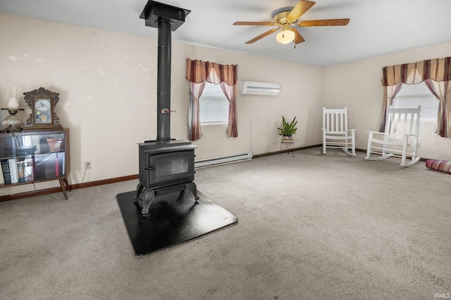 3739 S Westmont Ave, Bloomington, IN 47403 - carpeted living area featuring a wood stove, baseboard heating, a wall unit AC, and healthy amount of natural light