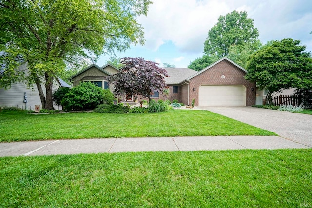 4019 E Bennington Blvd, Bloomington, IN 47401 - view of front facade featuring an attached garage, brick siding, and concrete driveway