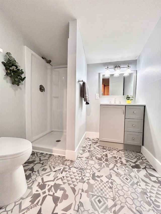 604 W Franklin St, Colfax, IN 46035 - full bath featuring walk in shower, baseboards, vanity, toilet, and tile patterned floors