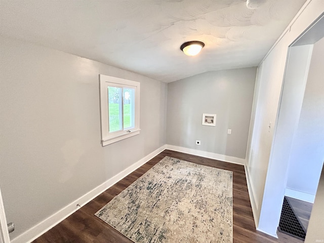 604 W Franklin St, Colfax, IN 46035 - spare room featuring dark wood-type flooring and baseboards