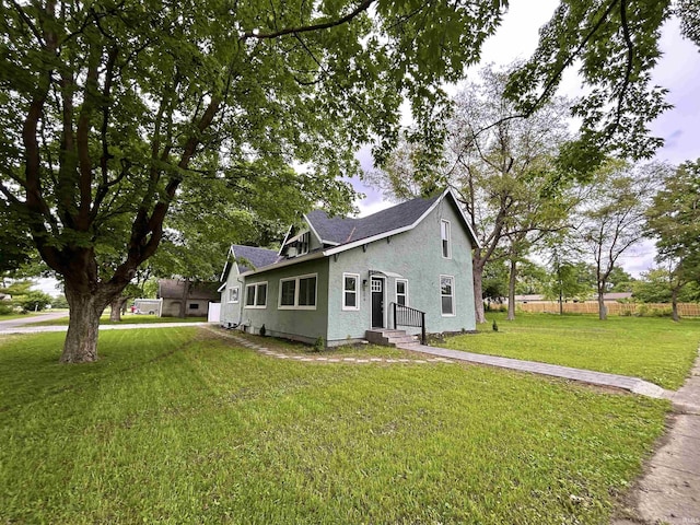 604 W Franklin St, Colfax, IN 46035 - view of front facade with stucco siding and roof with shingles
