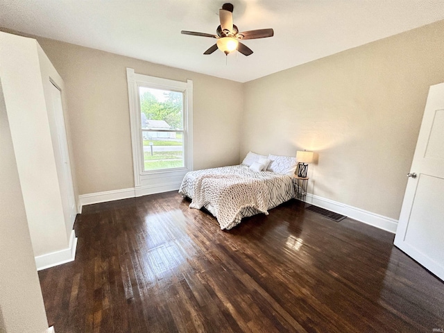 604 W Franklin St, Colfax, IN 46035 - bedroom featuring wood finished floors, baseboards, and ceiling fan