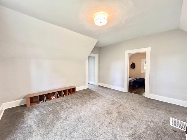 604 W Franklin St, Colfax, IN 46035 - bonus room featuring vaulted ceiling, carpet flooring, and baseboards