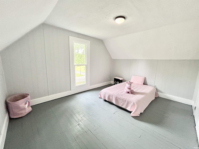 604 W Franklin St, Colfax, IN 46035 - bedroom featuring baseboards, lofted ceiling, and wood finished floors