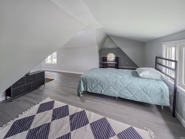 290 NW G St, Linton, IN 47441 - bedroom with baseboards, wood finished floors, and vaulted ceiling