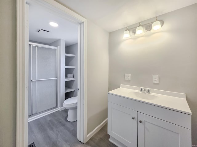 290 NW G St, Linton, IN 47441 - full bath featuring wood finished floors, a shower stall, toilet, and vanity