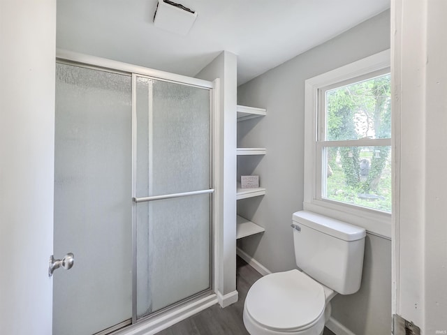 290 NW G St, Linton, IN 47441 - full bath with toilet, a stall shower, healthy amount of natural light, and wood finished floors