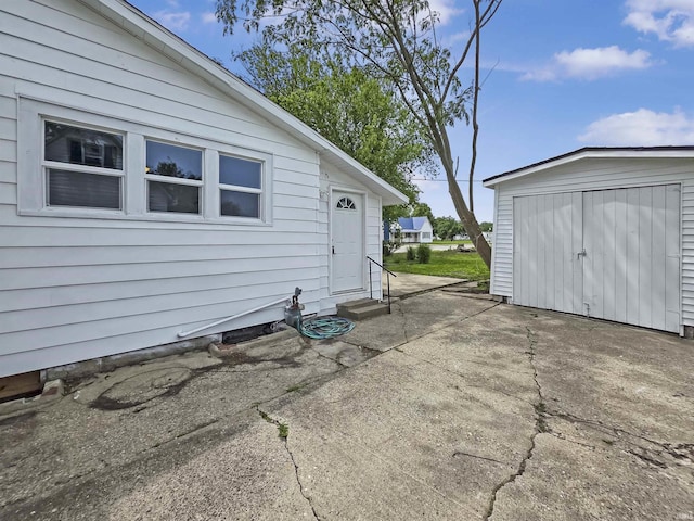 290 NW G St, Linton, IN 47441 - view of patio featuring entry steps and an outbuilding