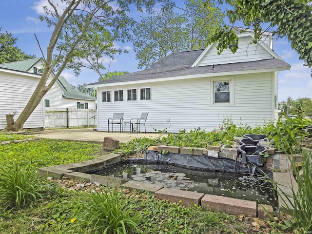 290 NW G St, Linton, IN 47441 - rear view of house featuring a patio area and roof with shingles