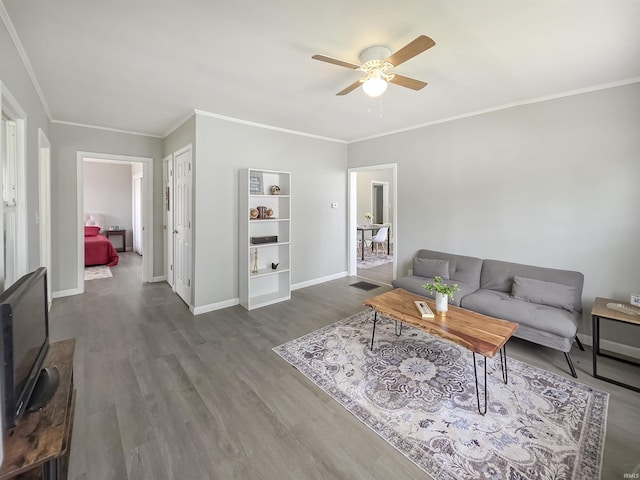 290 NW G St, Linton, IN 47441 - living room featuring a ceiling fan, wood finished floors, baseboards, and ornamental molding