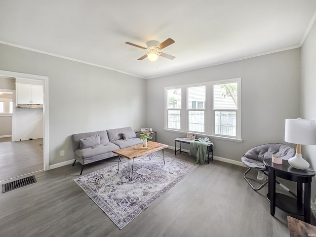 290 NW G St, Linton, IN 47441 - living area with wood finished floors, a ceiling fan, ornamental molding, and baseboards