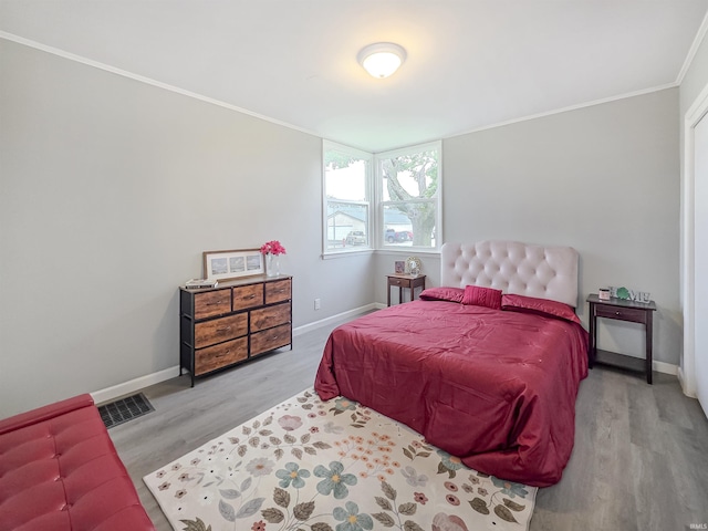290 NW G St, Linton, IN 47441 - bedroom with wood finished floors, ornamental molding, and baseboards