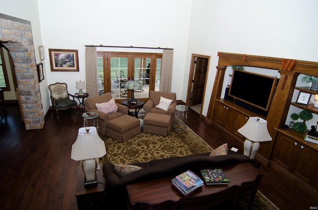 113 Lakewood Dr, Vincennes, IN 47591 - living room with dark wood finished floors, french doors, baseboards, a high ceiling, and decorative columns