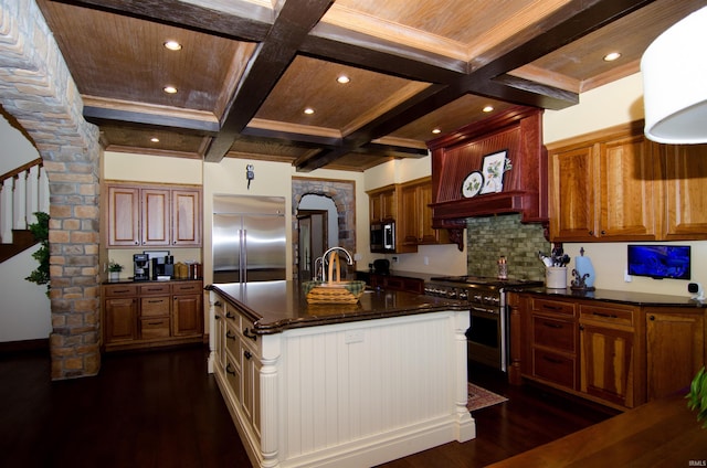 113 Lakewood Dr, Vincennes, IN 47591 - kitchen with high end appliances, coffered ceiling, arched walkways, dark wood finished floors, and beam ceiling