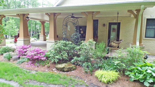 113 Lakewood Dr, Vincennes, IN 47591 - property entrance with covered porch, brick siding, and a ceiling fan