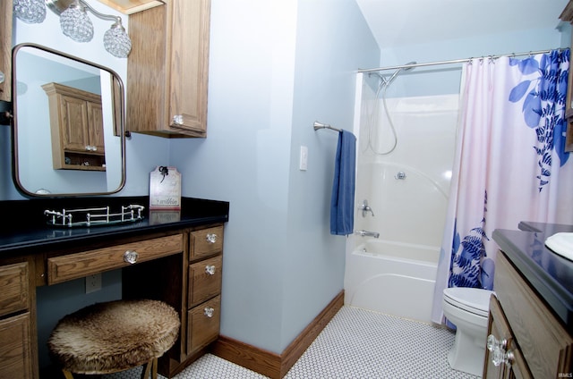 113 Lakewood Dr, Vincennes, IN 47591 - full bath featuring vanity, toilet, shower / tub combo with curtain, tile patterned flooring, and baseboards