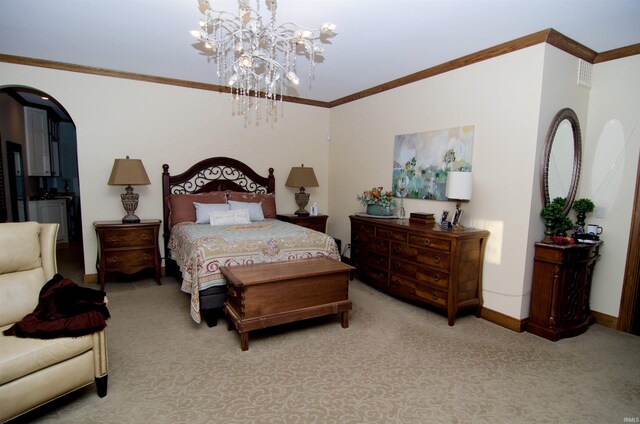 113 Lakewood Dr, Vincennes, IN 47591 - bedroom with light colored carpet, a chandelier, ornamental molding, arched walkways, and baseboards