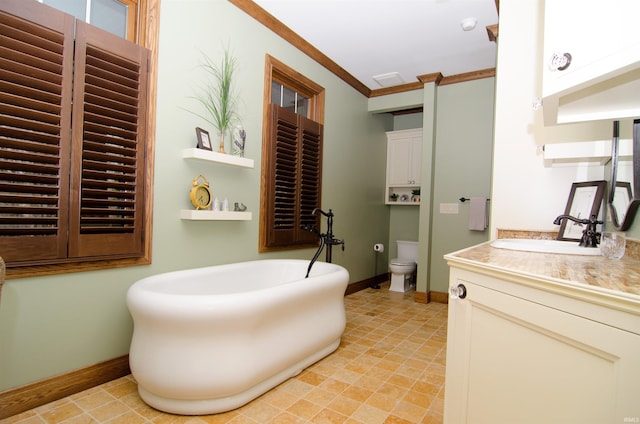 113 Lakewood Dr, Vincennes, IN 47591 - bathroom with vanity, a freestanding tub, ornamental molding, baseboards, and toilet