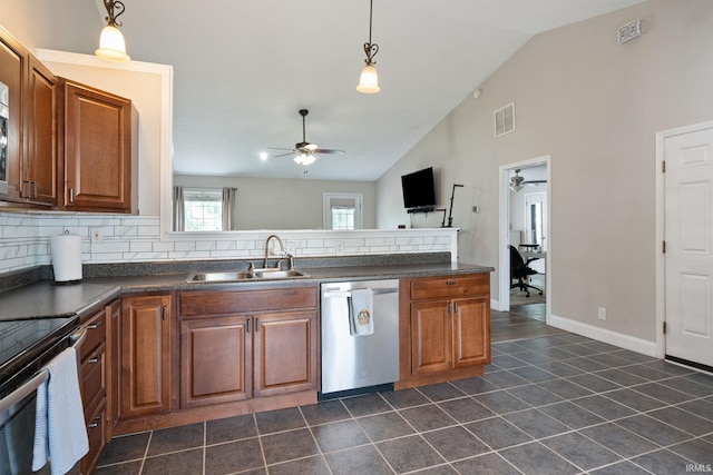 1606 Waverly Dr, Lafayette, IN 47909 - kitchen featuring appliances with stainless steel finishes, a sink, ceiling fan, dark countertops, and high vaulted ceiling