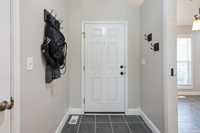 1606 Waverly Dr, Lafayette, IN 47909 - doorway with dark tile patterned flooring and baseboards