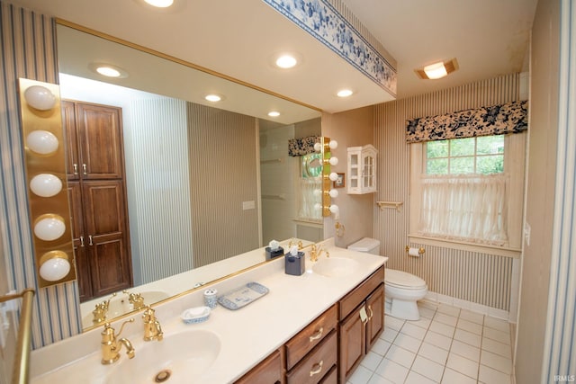 1301 E 4th St, Fowler, IN 47944 - bathroom with tile patterned flooring, double vanity, toilet, a shower, and baseboards