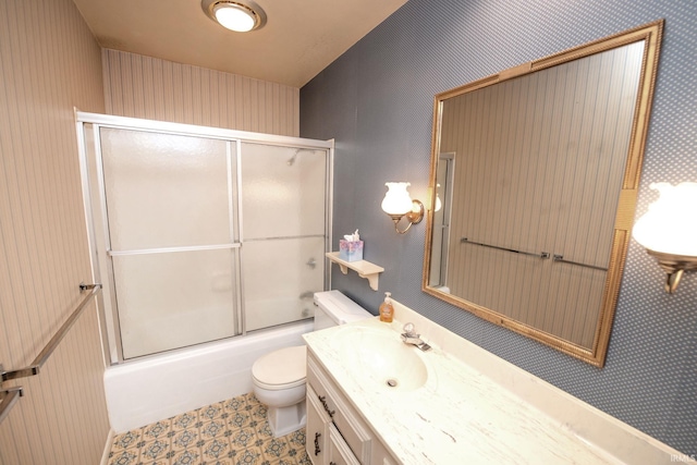 1301 E 4th St, Fowler, IN 47944 - bathroom with toilet, shower / bath combination with glass door, vanity, and wallpapered walls