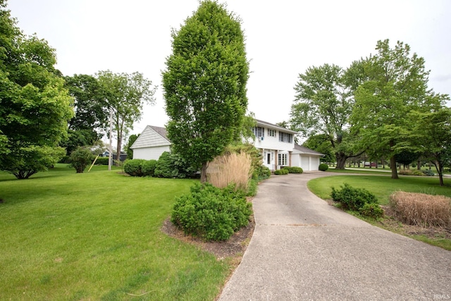1301 E 4th St, Fowler, IN 47944 - view of front of house with a front lawn, asphalt driveway, and an attached garage