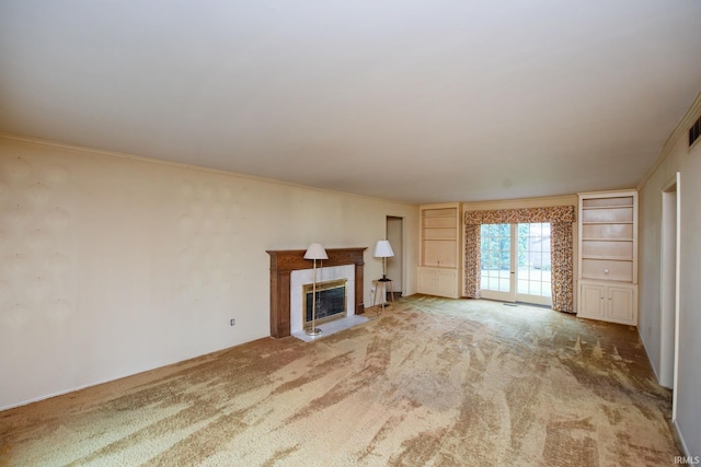 1301 E 4th St, Fowler, IN 47944 - unfurnished living room with carpet, a fireplace with flush hearth, ornamental molding, and built in shelves